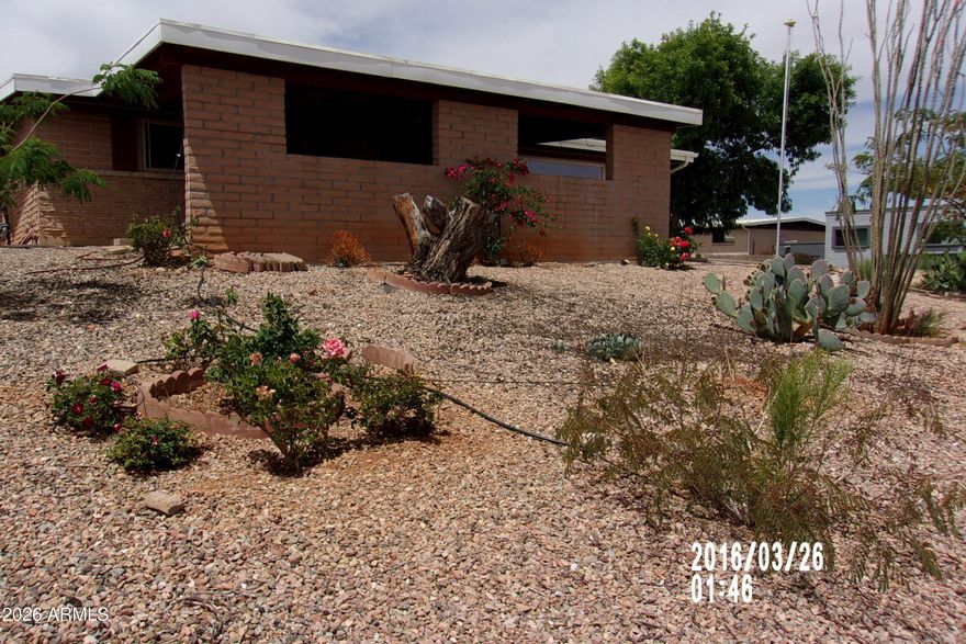 Three-bedroom, three-bath 2,000 sq. ft. site-built home on a desirable corner lot. Features a large two-car carport and an RV gate with easy access to the backyard, plus two storage sheds for added convenience. Enjoy outdoor living under the covered back patio. Inside offers newer stainless-steel appliances, including a double oven, along with washer and dryer. A spacious back recreation room includes a mini-split system for added comfort. A/C is in good condition. Home needs paint and flooring, making it a great opportunity to add your personal touch and value