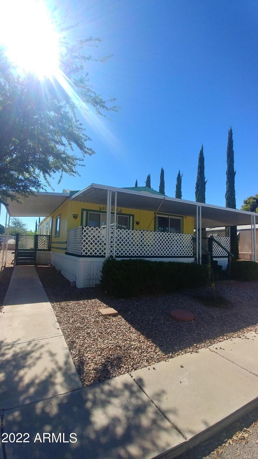 Friendly front  porch! 2 bedroom, 2 bath plus office/den. Dining room, breakfast bar. Good sized living area and master bedroom. 2 sheds. Chain link fence.