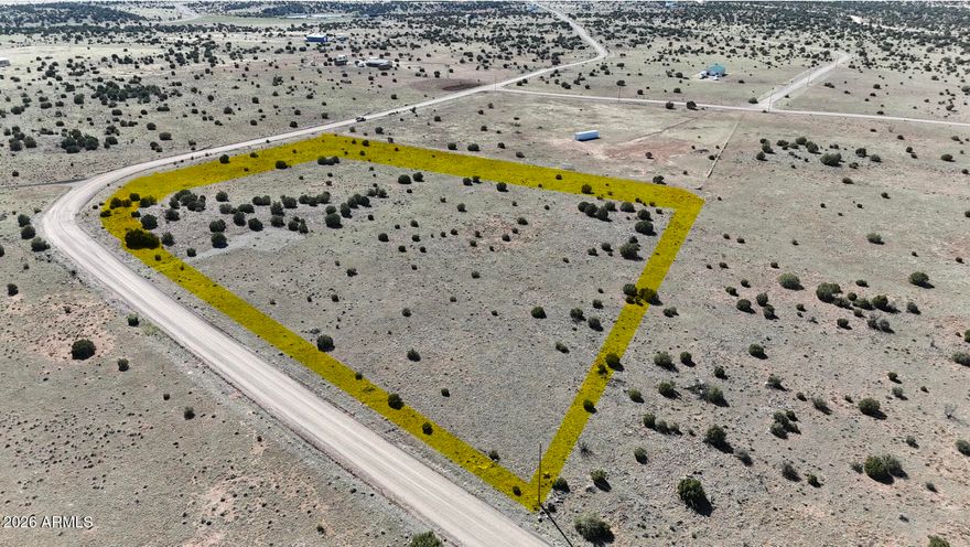 Expansive 7+ acre corner lot just off Highway 61 located in the Windsor Valley Ranch subdivision, featuring juniper-covered terrain and natural high desert vegetation. Ideal for a horse property or small ranch setup with room for livestock, RVs, or a custom or manufactured home. Enjoy cooler temperatures at over 6,000 ft elevation and peaceful open space. Gravel road access and electricity at the lot lines add convenience. Presently zoned A-General for flexible rural use. Approx. 30 minutes from Show Low's amenities. Buyer to verify all pertinent information. Drone video provided to showcase the beauty of this lot. Don't miss out on this amazing opportunity to secure your piece of Arizona land!