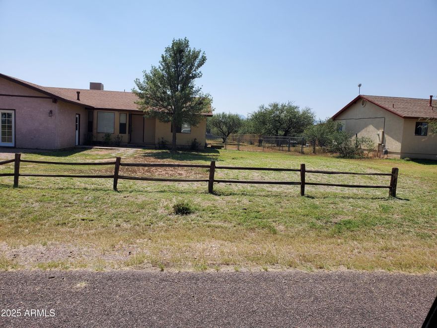 This home sits on a large corner lot.  Has 360 degree views. New roof was put on home 3 years ago. There is a covered patio in the back where you con look out at the mountains. There is tile through most of the home.  There is only carpet in the bedroom.  There is a large bonus game room with an a/c unit in the wall.
