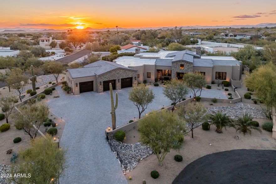 Absolutely stunning custom estate that will not disappoint. Carefully constructed & professionally designed (mostly RH furniture) in 2019, this meticulous acre+ property boasts luxury finishes throughout. The split & open floor plan offers 4 bedrooms (all ensuite), 4.5 baths, large office, convenient costco/storage room, and an oversized (1500 sqft) 3 car garage. The impressive great room features a beautiful gas fireplace with stone detailing, custom glass pocket doors designed for seamless indoor/outdoor living, and a formal dining room. The chef's kitchen is equipped with a large island, deluxe butler's pantry, beautiful custom cabinetry, and luxury appliances (Sub Zero & Wolf). The primary suite boasts a gas fireplace, private patio exit, and spacious bathroom with marble (floor, shower, countertops), dual vanities, large walk-in shower, separate soaking tub, toto toilet, and an oversized closet with island. Down the primary hall is a gorgeous powder bath, expansive laundry room, storage room, and entry to the large garage. The guest wing of the home features three guest suites all with uniquely designed bathrooms, plus an office/bonus room that opens to the great room.

The backyard sanctuary includes a heated pool and spa w/ relaxing water features, a private primary suite patio with outdoor shower, and a turf yard with a newer 5-hole putting green & chipping pad (2023). The large covered/uncovered patio includes an outdoor kitchen with built-in BBQ, gas fireplace & commercial misting system making this the perfect space to enjoy year round. Additional upgrades and features include exterior paint (2023), landscaping (2024), over 30k in light fixtures, Anderson windows & sliding doors, gated & pavered driveway, mechanical sun shades, Trane 18 Seer multi-zoned AC/heat pump system (3 units), multiple smart home features, and much more throughout. Plus, most of the furniture & furnishings are available on a separate bill of sale to make this a smooth & easy move-in.

This smaller north Scottsdale neighborhood provides a serene & private setting yet is only minutes from all that Scottsdale has to offer. This home is truly immaculate and an absolute must see.