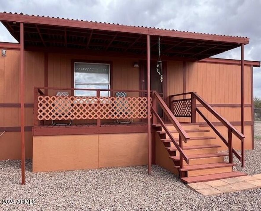 CUTE as can be and move-in ready! This adorable well maintained home is a perfect winter home, permanent residence or fun getaway. Located on 2 lots, 250 gallon owned propane tank, 16 x 70' storage shed, completely chain link fenced, 2 RV gates and just a few minutes to Sierra Vista or Benson for shopping and your medical needs. Sturdy Concrete board siding and double windows for energy efficiency. Includes newer washer & dryer. Enjoy mountain views from front & back covered decks. A great home for a great price! Call for more information today!