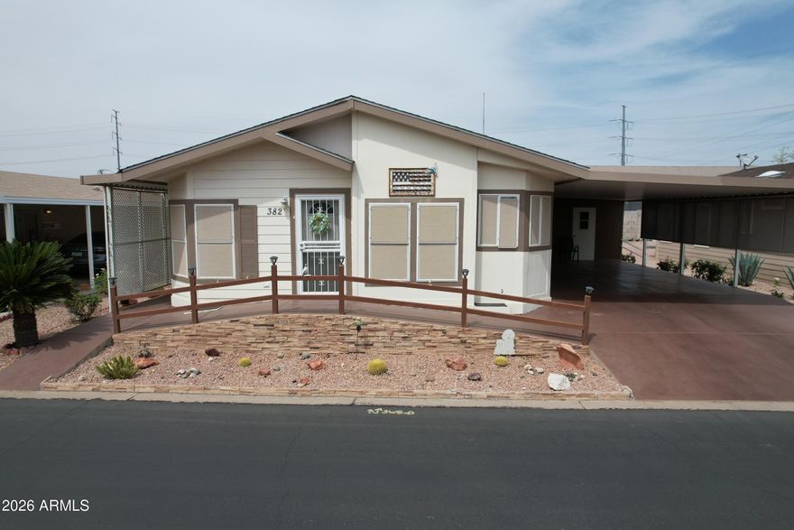 Welcome to your charming new home in the highly sought after Rose Gardens Resort. An Active senior living community with a vibrant array of indoor and outdoor activities. This inviting 2 bedroom 2 bathroom home also features a cozy den, a formal dining room and an eat-in kitchen. Ideal for all your entertaining needs. Enjoy Arizona's beautiful weather from your screened in Arizona room, and take advantage of the convenient separate workshop. South facing for maximum sunlight. This home boasts bamboo flooring through out the main living area. Exceptionally well maintained with its outdoor irrigating system to maintain your beautiful landscaping. This friendly, no-rentals allowed community awaits its newest neighbor. Don't miss the chance to make this your home.
