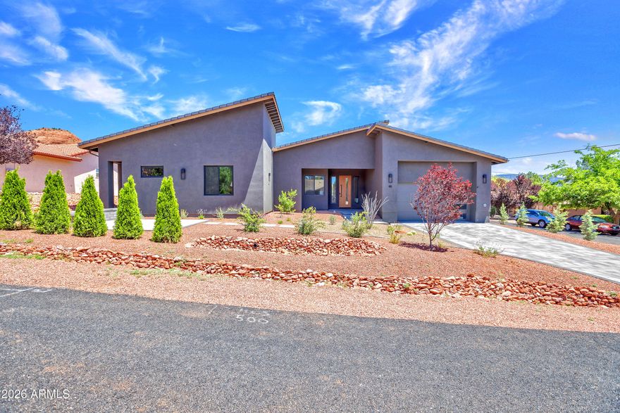 BRAND NEW, JUST COMPLETED Contemporary  Home on corner lot; Perfect for family or STR!  Fully furnished, can sleep 16;  Spacious LR/DR/Kit Open area w/ beautiful fireplace & views. 3 patio areas one with privacy fence for Hot Tub privacy.  Lots of storage and private areas, two primary suites, + 3 add'l BR's - 4 baths, Room for Everyone to Roam! Hiking just out your door-& all  amenities are minutes away. Fully landscaped, paver driveway. Garage has epoxy floor and is fully setup as a game room.  Great potential as an STR as very desirable location! Must See to Appreciate all amenities.  Centrally located in West Sedona- E-Z access to all activities, restaurants, groceries, hiking,: LOCATION, LOCATION, ETC.  BEST YET, ROOFTOP AMAZING VIEWS-ENJOY THUNDER MTN & ENTIRE NORTH VIEW
