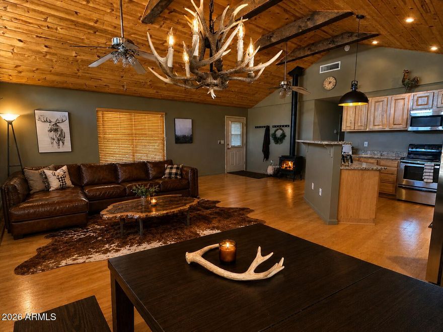 Check out  the new enhancements recently made to the home. A true slice of heaven. Whether you are looking for a hunting cabin or a vacation retreat, this home sits just minutes from Woods Canyon Lake, the town of Payson & an easy 1.5-hour drive from Mesa. Set on a full acre of pristine forested land with sweeping views of the Mogollon Rim, this property is thoughtfully positioned to gather family/friends while embracing the serenity of Northern Arizona living. Rustic charm meets everyday convenience with an effortless lock-and-leave lifestyle and room to make it your own. The main level offers all essential living, complemented by a walk-out basement bonus space--ideal for hosting, a game room, man cave, or private retreat. Soak in the outdoors from the covered patio, unwind around the campfire, or take a short stroll to the nearby creek. Inside, vaulted ceilings, tongue-and-groove wood details, picture windows, and stainless steel appliances create a warm, inviting atmosphere that's both functional & full of character. Whether you're looking for a weekend escape or a place to build lasting memories, this mountain retreat delivers space, versatility, and that hard-to-find "getaway" feel