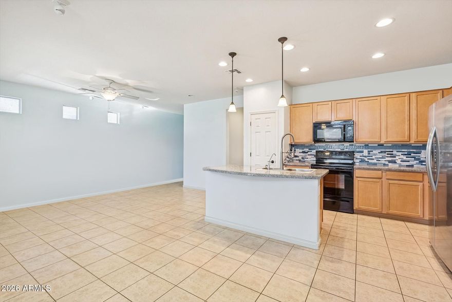 A true turn key home - just steps from the clubhouse and lake in this gated adult community! This light-filled home features an open split floor plan, a granite kitchen with a large island, and an oversized secondary bedroom perfect for an office or hobby space. Enjoy your morning coffee on the charming front porch, then relax out back with ravine views, mature greenery, and a private putting green. Love to travel? The fully enclosed patio with powered, weatherproof screens lets you lock up and go with total peace of mind - comfort and convenience all year long! The icing on top? The incredible neighbors the sellers are sad to leave behind.