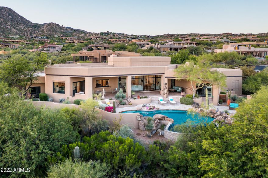Golf Membership available from seller.  Located in the world class community of Desert Mountain, this home made of block construction offers spectacular city lights, mountain and beautiful sunset views as well as sits next to natural area open space for ultimate privacy.  With four spacious suites, study/5th bedroom, dining room, living room, family room and terrific outdoor patio space, this stunning home checks all the boxes.  The outdoor entertaining area is complete with fireplace, pool, spa, bbq and excellent covered area to enjoy all of the views.  The  split floor plan flows seamlessly, with three suites on one side of the home and the master and study/5th bedroom on the other side.  Available to be purchased turn key.  Truly a must see.  For more For more than three decades, Desert Mountain has been providing its Members with one of the world's finest year-round golf and lifestyle experiences. The Club's master plan was conceptualized by Taliesin Associated Architects, a firm founded by the legendary Frank Lloyd Wright, and designed to subtly harmonize with the magnificent natural landscape that surrounds the illustrious 8,300-acre property located in North Scottsdale Arizona. The Desert Mountain Club features Seven golf courses, seven clubhouses and nine different dining options from formal to casual. 

The Sonoran Fitness center and Spa offers the newest equipment and is staffed with top wellness and sports professionals, the expansive Fitness Center has everything you need for a total body workout, from muscle conditioning and flexibility to private personal training, group classes, and on-site physical therapy. The beautifully appointed Spa offers a wide range of services, including therapeutic massages, repairing facials, haircuts, color, and even acupuncture treatments.The Tennis Complex features five state-of-the-art Har-Tru green clay tennis courts, three fast-playing hard courts, and a spectacular stadium grass court. Members can enjoy spirited competition and socializing on six new pickleball courts. 

In addition Desert Mountain has a private trail system that borders the Tonto National forest and encompasses 20 miles of panoramic desert scenery and lush mountain flora. By two feet or two wheels, explore the eastern slope of the Continental Mountains, enjoy views for miles from the 4,100-foot summit that overlooks landmarks like Skull Mesa, Elephant Butte, and Harquahala Peak. 

Desert Mountain is proud to be distinguished by the Platinum Clubs® of America, considered as the most respected recognition in the private club industry. Every two years, clubs are judged for their history, ability to attract and retain exceptional members, and the experience delivered. Criteria include recognition, excellence in amenities and facilities, staff and professional services, quality and commitment of membership, governance and prudent fiscal management, adapting to changing times, and overall experience. Desert Mountain Club currently ranks #14 in the country on the 2021-2022 list, and is the highest ranking club in Arizona in the Country Club category.