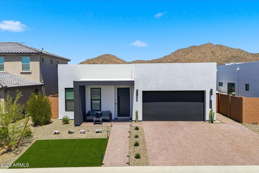 Better than new, this Shea Homes residence in Ascent at Aloravita showcases ~$95K in upgrades and a designer backyard built for entertaining. Enjoy lush, low-maintenance turf, a built-in gas BBQ with Evo grill, and a shaded gazebo--ideal for outdoor dining. Inside, the bright open-concept kitchen and great room feature a dramatic waterfall-edge island, upgraded appliances, and effortless flow for gatherings. Custom window shades throughout add style and convenience. The private primary suite offers a spacious walk-in closet, oversized walk-in shower, and dual sinks. Split plan includes two bedrooms, full bath, and powder room. Three-car tandem garage prewired for EV.
