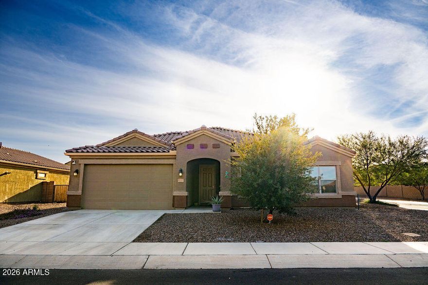 Beautiful 4-bedroom home featuring a $15,000 fully finished backyard designed for outdoor enjoyment. The spacious open-concept living, dining, and kitchen area creates an inviting space perfect for entertaining. Double sliding doors in the living room open wide, enhancing the indoor-outdoor flow and filling the home with abundant natural light from large windows throughout. The primary suite boasts a massive walk-in closet with a convenient connecting laundry room. Additional upgrades include a water softener and tankless water heater. Enjoy resort-style community amenities including a clubhouse with kitchen available for events, onsite gym, two pools, splash pad, parks, and picnic areas. This neighborhood offers a next-level lifestyle with everything you need just steps from home.
