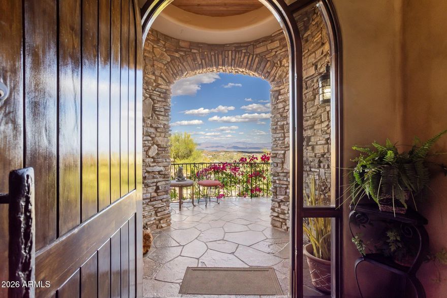 Unmatched views. Irreplaceable setting. A rare opportunity! Perched on a private hillside in Scottsdale's Troon Village with commanding vistas of Troon Mountain and the Four Peaks, this home delivers a level of luxury and exclusivity that is simply not being replicated at this price point. Spanning 5,500+ square feet, this Italian-inspired estate was built for those who demand both sophistication and presence. Expansive living spaces, soaring ceilings, and walls of glass frame breathtaking desert views--creating a daily experience that feels like a private resort. The kitchen and great room were designed to impress, flowing effortlessly into a full bar and entertainment space ideal for hosting at any scale. Disappearing glass doors open to a backyard that rivals five-star resorts--complete with a heated pool and spa, dramatic rock waterfall, outdoor fireplace, and built-in BBQ. This is Arizona living at its absolute peak. The split floor plan offers privacy and flexibility, anchored by a luxurious primary retreat with dual closets and a private fitness space. Ensuite guest rooms, a dedicated executive office, home theater, and a 500+ bottle wine room elevate this home into a true entertainer's estate. With an elevator, climate-controlled garage, and recent system upgrades already completed, this home delivers both convenience and peace of mind--making it ideal as a full-time residence or lock-and-leave luxury escape. Homes with this combination of views, privacy, scale, and upgrades in Troon are exceptionally limited.