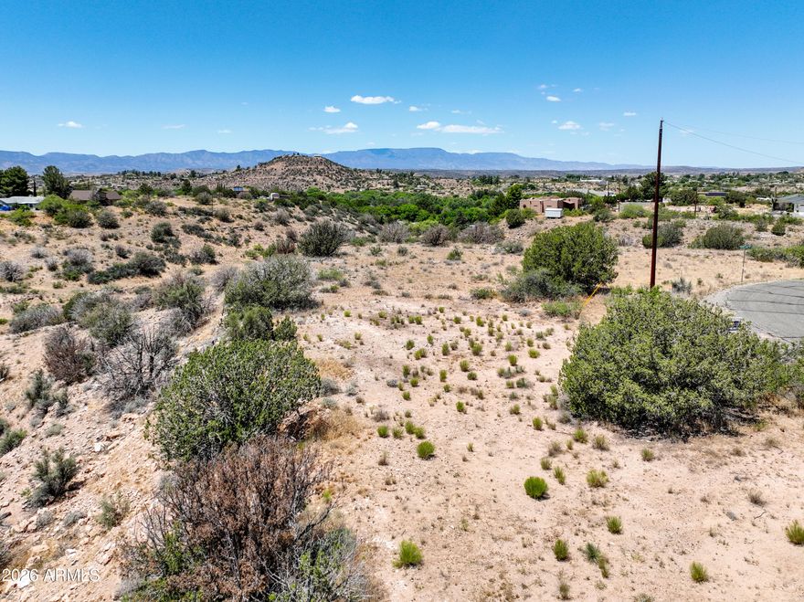 Build your custom retreat on this 1/3 acre lot in Rimrock, located just 25 minutes from the Village of Oak Creek and 30 minutes from Sedona. This property is situated in a No-HOA environment within a neighborhood dedicated to site-built homes only. Infrastructure includes direct paved road access and power available across the street. The topography offers an efficient building site at the front of the lot with a gulch on the back half. This area is in close proximity to the Verde Valley and the Northern Arizona trail systems. This parcel provides the utility and space required for a refined Arizona lifestyle in a rural setting.