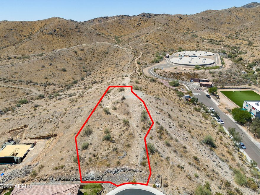 Rare opportunity to own the highest lot nestled within this gated luxury community of Legacy Mountain Villas. This cul-de-sac homesite offers the chance to create a custom retreat surrounded by the beauty of South Mountain with panoramic views. Enjoy private neighborhood access to scenic walking trails while staying just minutes from Raven Golf Club, Diablo Stadium, ASU, Downtown Phoenix, and Sky Harbor Airport.  A perfect setting for buyers seeking privacy, outdoor living, and convenience in this highly desirable mountain community.
