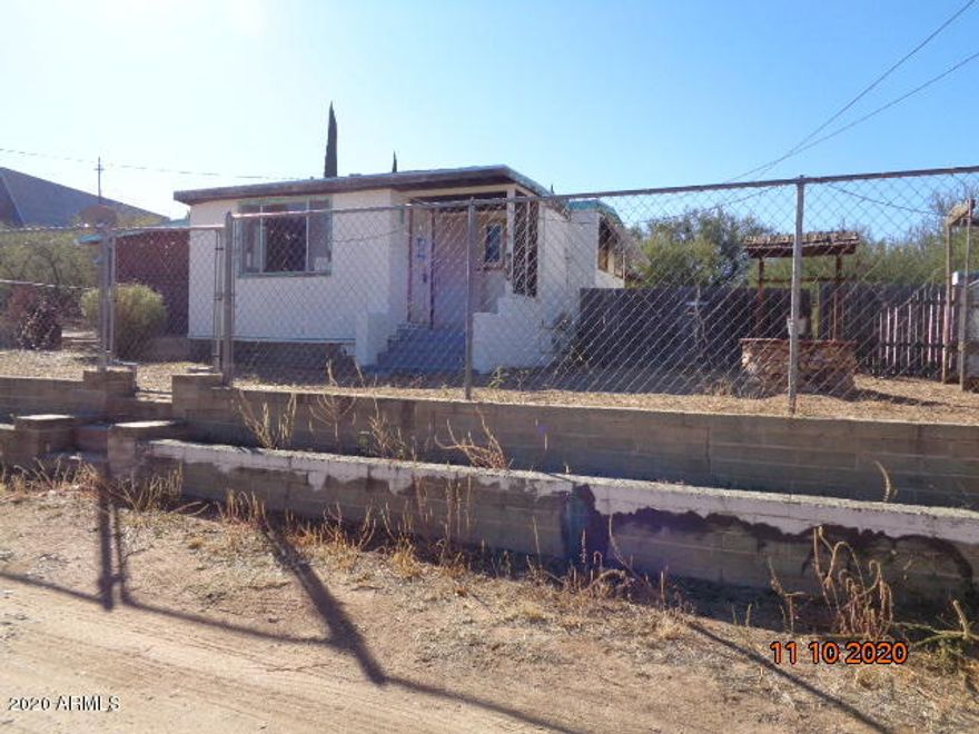 This is a great investment opportunity in a great area. Close to schools, shopping and more. There is a fenced front and back yard with RV gate and a detached workshop. The home features 1 large bedroom and a large living room. There is an eat in kitchen and a large laundry room. This property will not last