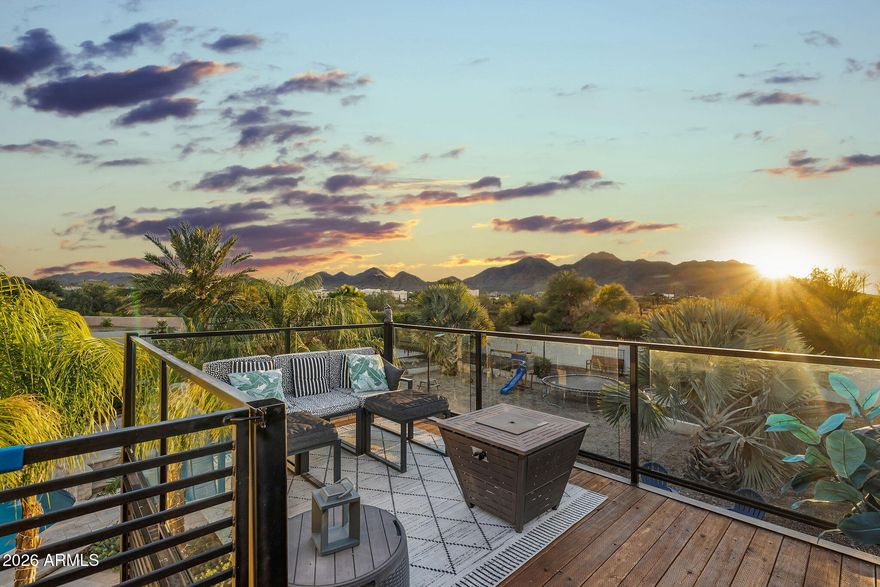 Located in the exclusive gated community of Encanto Paseo and set on an expansive 1.33-acre lot, this property offers exceptional privacy, breathtaking San Tan Mountain views, sparkling city light views, and the peaceful beauty of the surrounding desert landscape, all framed by the dramatic backdrop of San Tan Regional Park.
The spacious great room floor plan is designed to capture the incredible views & provide seamless everyday living. The gourmet kitchen features top-of-the-line stainless steel appliances, marble countertops, custom backsplash, & a walk-in pantry. The private primary suite includes 2 large walk-in closets, separate vanities, designer mirros, soaking tub, separate shower & private access to the covered patio. A front office offers inspiring mountain views. Step outside to an entertainer's dream backyard complete with a private pool, covered patio, exterior fireplace, ramada, sport court, lush landscaping, and a viewing deck perfectly positioned to enjoy mountain views, city lights, and Arizona's beautiful starry skies. A detached 400 sq ft space adds flexibility for guests, a private office, gym, or hobby room. Additional features include a large laundry room and oversized 3-car garage. Located just minutes from Queen Creek Marketplace, shopping, dining, and highly rated schools including Casteel, American Leadership Academy, and Benjamin Franklin Charter Schools. A rare opportunity to own a private custom-lot retreat in one of Queen Creek's most desirable gated communities.