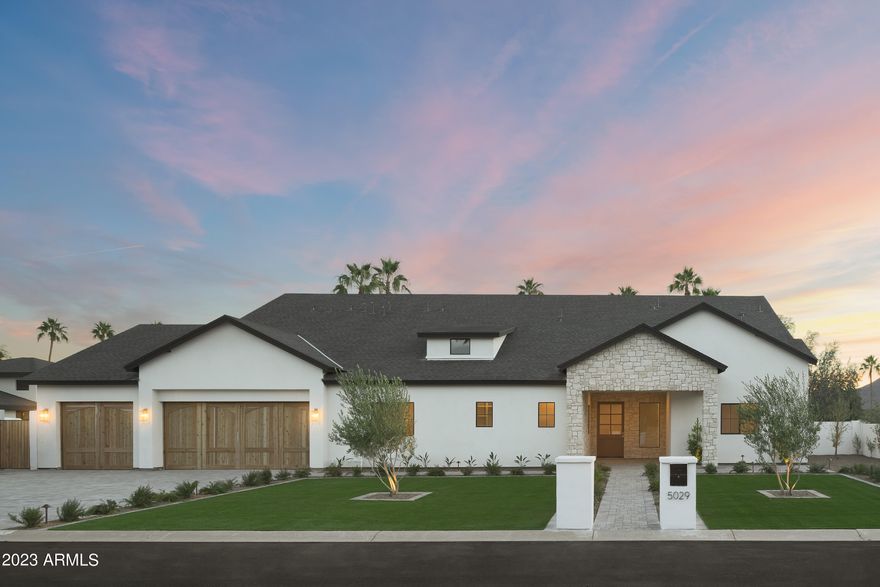 Welcome to this brand new Travis Custom Homes built residence with a stunning desert organic vibe. From the moment you step foot in this beautifully designed home you can feel the warmth and earthy depth of the design brought forth by Kozi Designs. The great room, adorned with a 16' peak takes in an abundance of light from the dual sets of 4 panel pocket doors leading to a massive covered patio. The kitchen is designed with a large lime washed hood with the backdrop of an entire wall of curated stone as the backsplash. The entertainer's dream includes 2 massive islands, 2 sinks, dual dishwashers and separate fridge and freezer. The split floor plan includes 4 spacious bedrooms, all with their own bathroom and an owners retreat any buyer could dream of. Don't miss out on this one! pool deck, built in bbq, a covered patio that encompasses the entirety of the back of the home and huge lower grass area. You won't want to miss the design aspects of this one!