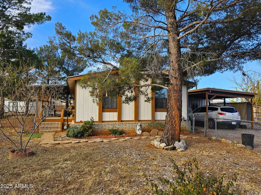 Nice 2-bedroom, 2-bath home located on a large lot in a cul-de-sac. The versatile floor plan offers two spacious living areas, providing flexibility for everyday living or entertaining. The kitchen features newer appliances, and the covered front porch is a great place to relax. Outside, the fenced yard is ideal for pets, gardening, or outdoor enjoyment. The property also includes a covered carport and a large storage/workshop for added convenience.