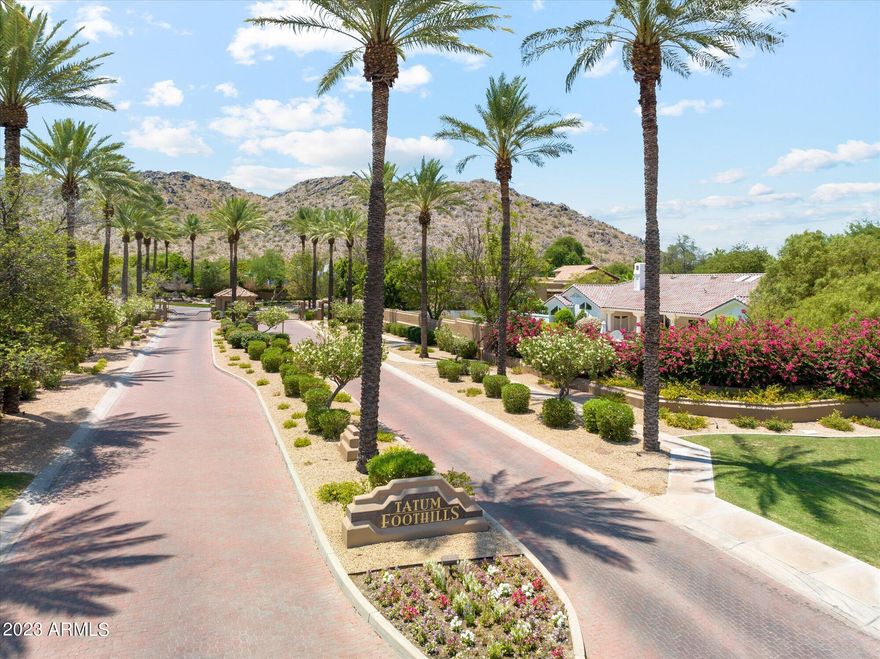 EXPERIENCE THE EPITOME OF LUXURY AND TRANQUILITY IN THE PRESTIGIOUS GATED COMMUNITY OF TATUM FOOTHILLS, WHERE RESORT-STYLE LIVING MEETS STUNNING MOUNTAIN VIEWS ON A PRIVATE CUL-DE-SAC LOT. THE CUSTOM OVERSIZED WOOD AND GLASS FRONT ENTRY SETS THE TONE AS YOU ENTER THE MAIN LIVING AND DINING AREA WITH ITS SOARING WOOD BEAMED CEILINGS AND PLANTATION SHUTTERS. THE CHEF'S KITCHEN FEATURES WOOD CABINETS WITH ROLL-OUT SHELVING FOR CONVENIENCE AND EASE, LIGHT AND BRIGHT QUARTZ COUNTERTOPS, WOLF STAINLESS STEEL APPLIANCES, A 6-BURNER GAS RANGE, DOUBLE OVENS, R/O SYSTEM, AND AN OVERSIZED BRAND-NEW REFRIGERATOR. YOU WILL ALSO FIND 2 CENTER ISLANDS, ONE IS A WATERFALL ISLAND, AND FEATURES EAT-UP BAR SEATING, A BUILT-IN WINE FRIDGE AND AN UNDER-COUNTER ICEMAKER THAT ARE SEAMLESSLY INTEGRATED, ENSURING THAT REFRESHMENTS ARE ALWAYS AT HAND AND CREATING A PERFECT GATHERING SPOT. JUST OFF THE KITCHEN ISLAND IS A COZY BREAKFAST NOOK WITH A WALL OF WINDOWS BRINGING IN LIGHT AND GORGEOUS MOUNTAIN VIEWS. THE FAMILY ROOM, OPEN TO THE KITCHEN EXUDES BOTH STYLE AND COMFORT WITH WOOD FLOORING, AN ELEGANT, STACKED STONE FIREPLACE, A CUSTOM BUILT-IN TV CABINET AND A LARGE RETRACTABLE SLIDING GLASS DOOR THAT OPENS TO THE COVERED PATIO WITH AN EXTENDED PERGOLA. THE LARGE MASTER SUITE BOASTS WOOD FLOORING, TWO SEPARATE FRENCH DOORS LEADING TO THE BACKYARD AND A SPACIOUS SITTING AREA WITH A COZY FIREPLACE, CREATING THE PERFECT HAVEN FOR RELAXING AND UNWINDING. THE MASTER SPA-LIKE MASTER BATH PROVIDES FUNCTIONALITY WITH DESIGN AND INCLUDES DUAL SINKS, ONE WITH A MAKE-UP VANITY. A WALK-IN SHOWER, A LUXURIOUS SOAKING TUB AND ELEGANT WALL NICHES FOR ADDITIONAL STORAGE. ADDITIONAL BEDROOMS ALL FEATURE PLANTATION SHUTTERS. ONE OF THE BEDROOMS FEATURES A SEPARATE ENTRANCE AND ENSUITE-BATH, MAKING IT IDEAL FOR AN IN-LAW SUITE OR PRIVATE HOME OFFICE. OUTSIDE YOU WILL FIND A RESORT-STYLE OASIS THAT WILL LEAVE YOU BREATHLESS WITH AN INVITING POOL AND SPA, EXQUISITELY ENCLOSED WITH A STYLISH GLASS FENCE AND SURROUNDED BY TRAVERTINE. A NEW FILTER, PUMP AND TILE HAVE BEEN RECENTLY ADDED AND UPDATED AS WELL AS A PENTAIR POOL CONTROL SYSTEM. TO ENSURE COMFORT, A PATIO SUNSHADE HAS ALSO BEEN THOUGHTFULLY INSTALLED. A BUILT-IN OUTDOOR KITCHEN, COMPLETE WITH A CHARMING PERGOLA, BUILT-IN BBQ AND EAT-UP BAR SEATING, INVITE YOU TO CHANNEL YOUR INNER CHEF AND ENTERTAIN GUESTS. A GAS FIREPIT NEAR THE POOL, OFFERS A COZY SEATING AREA TO ENJOY QUIET EVENINGS BY THE FIRE. EASY-CARE SYNTHETIC GRASS ADDS TO THE LUSH LANDSCAPING THAT HAS BEEN ENHANCED WITH UPGRADED LIGHTING AND AN IRRIGATION SYSTEM. A BUILT-IN GARDEN WITH AUTOMATED WATERING ADDS A TOUCH OF NATURAL BEAUTY. THIS BACKYARD ALSO OFFERS MAJESTIC MOUNTAIN VIEWS, AND IS A SPACE WHERE YOU CAN UNWIND, ENTERTAIN, AND CREATE CHERISHED MEMORIES FOR YEARS TO COME! ADDITIONAL FEATURES OF THIS HOME INCLUDE 3 NEW WATER HEATERS, 2 NEW HVAC'S, UPGRADED KITCHEN WINDOW, IRRIGATION PANEL, DIMMERS, MOTION LIGHTS, UPGRADED FANS THROUGHOUT, INDOOR/OUTDOOR SURROUND SOUND, UPGRADED LIGHTING, DAY & NIGHT AUTO LIGHTING, ECOBEE ENERGY EFFICIENT HOME AND AN AIR CONDITIONED 3-CAR GARAGE. THIS HOME OFFERS AN UNPARALLELED BLEND OF FINISHES, SOPHISTICATION, AND COMFORT. DON'T MISS YOUR CHANCE TO INDULGE IN THIS EXTRAORDINARY HOME!
