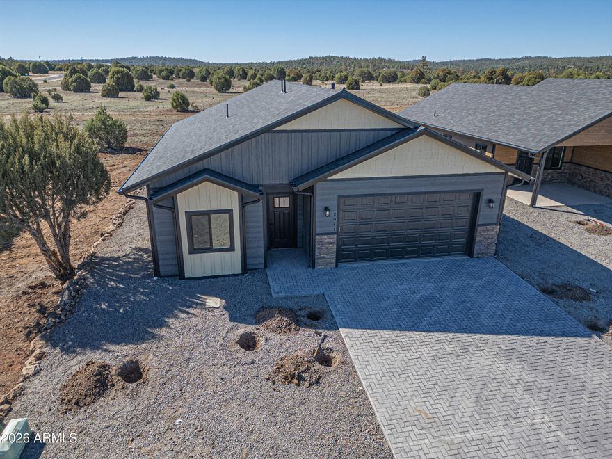 Welcome to your brand-new mountain retreat in the highly desirable Show Low Bluff! This beautifully built 1,297 sq. ft. home combines modern finishes with the peaceful charm of the White Mountains. Step inside to an open and inviting living space featuring granite countertops, stylish finishes, and a thoughtfully designed floor plan. The kitchen comes fully equipped with all new appliances, making it move-in ready for cooking and entertaining. This home offers 2 bedrooms and 2 bathrooms, including a comfortable primary suite with a walk-in closet and beautifully tiled shower. Both bathrooms feature quality tile work, adding a clean and modern touch. 
See More Outside, you'll appreciate the stamped concrete driveway and low-maintenance exterior, perfect for enjoying the surrounding natural beauty.
Ideally located near the best of the White Mountains, this home is just minutes from hiking, fishing, shopping, dining, and outdoor recreation, with easy access to nearby lakes, trails, and everything the area has to offer.

Whether you're looking for a full-time residence, vacation getaway, or investment property, this stunning new build offers the perfect blend of comfort, style, and location.