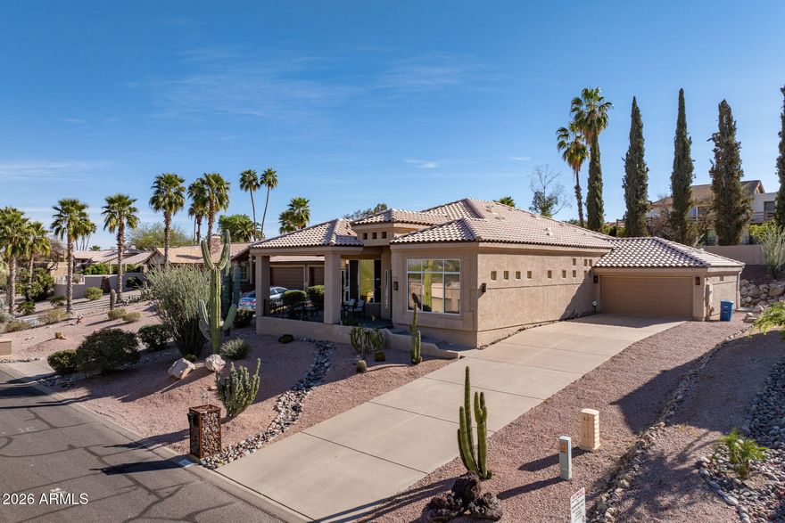 Welcome to this exceptional Fountain Hills beauty, where luxury meets convenience. Step inside and be amazed by soaring 15-foot ceilings and expansive, oversized butted windows that flood the interior with natural light and frame breathtaking views of the Four Peaks mountains. The stylish kitchen boasts quartz and granite countertops, a spacious walk-in pantry, stainless steel appliances, and a built-in desk area--perfect for everyday living and entertaining guests.
The thoughtfully split main bedroom suite features its own oversized windows with magnificent mountain vistas, dual walk-in closets, and a brand-new oversized tile shower for a spa-inspired retreat. All bedrooms and closets are enhanced with new wood-look laminate flooring for a modern touch. Outdoors, new paver extend along the entire back of the home, including the inviting covered patio, creating ideal spaces for relaxation. Enjoy the easy-care backyard, designed for minimal maintenance and maximum enjoyment. Don't forget to review the comprehensive list of recent improvements under Documents.  Note the plantation shutters - skylights in hall and middle bathroom; new roof in 2018 and one new a/c unit in 2019.  NO HOA - Located close to the world famous Fountain Park and all that Fountain Hills has to offer.