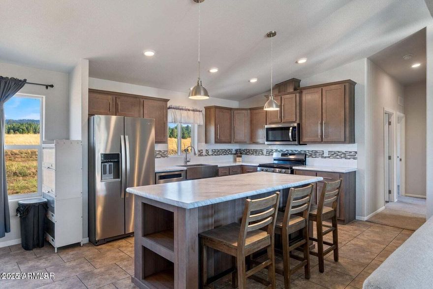 Modern Mountain Retreat with River Views, Greenhouse— Ready for Off-Grid Potential with NO HOA!!! Welcome to your serene escape along the San Francisco River—this 2021 Champion AF2856E manufactured home offers 1,493 sq ft of well-designed living space, featuring 3 bedrooms and 2 full bathrooms. This home boasts 2x6 construction for superior snow load and wind resistance, as well as enhanced insulation for optimal winter comfort. Inside, you'll find an inviting open-concept floor plan. The kitchen is a true centerpiece, offering a large farm-style sink, an expansive island perfect for entertaining, and seamless flow into the living room. The spacious primary suite includes a generous walk-in closet and a luxurious bathroom with a garden tub surrounded by windows ideal for relaxing while soaking in the view.