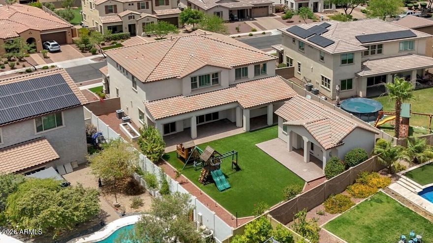 Rare opportunity in the highly sought after master planned community of Verrado! This expansive home offers 4,624 total sqft, including a permitted detached 472 sqft climate controlled studio with full bathroom, ideal for a home office, guest retreat, gym, media room, hobby space or flex room.

The main residence features 4,152 sqft with 6 bedrooms, 4 bathrooms, a den and an exceptional open concept designed for both everyday living and entertaining. The kitchen showcases white shaker cabinets extended to the ceiling with crown molding, stainless steel appliances, double ovens, a large center island with seating, a butler's pantry and an oversized walk in pantry offering abundant storage. Freshly painted interior in neutral color, this home feels bright, clean and move in ready. Additional upgrades include a premium whole home air scrubber system designed to significantly reduce dust, allergens and airborne particles, helping improve overall indoor air quality and comfort. Spacious living areas, large bedrooms and the rare detached studio make this one of the most unique homes available in Verrado. Enjoy all the amenities Verrado is known for including parks, golf, trails, community events, shopping, dining and charming small-town appeal with easy access to the greater Phoenix area.