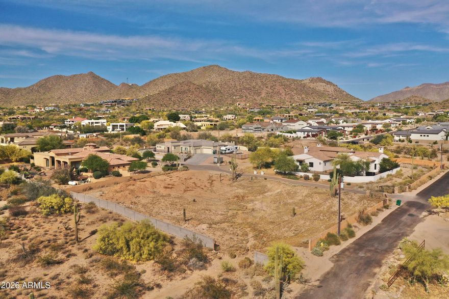 Incredible opportunity to own a premium lot in Northeast Mesa with panoramic sunset and city light views. Situated near a newly paved road, this property offers no HOA restrictions, a reduced south setback of 20' instead of 40', giving you maximum design flexibility. All the groundwork is complete: approved septic permit, recorded water rights with the City of Mesa, and a full discovery package including percolation & soil tests, water flow test, and ALTA survey. Included are fully completed plans for a 5,700 sq ft basement home plus a 1,200 sq ft guest house with RV garage - perfect for multi-generational living, guest quarters, or a private office. Enjoy the best of outdoor and city living with quick access to Usery Mountain Park, the Salt River, and Tonto National Forest!
