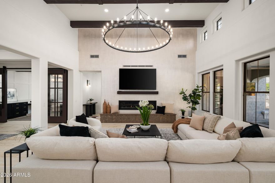 Experience the finest of DC Ranch living in this completely renovated Spanish Modern residence, ideally positioned on an oversized corner lot within the gated Desert Haciendas community. Completed in January 2026, this home underwent a full interior and exterior transformation, delivering timeless design and modern luxury throughout. The expansive open concept floor plan showcases custom cabinetry, refined surfaces, designer lighting, new appliances, a butlers kitchen, and an expanded laundry and craft space. A dramatic iron entry door opens to oak flooring that flows seamlessly throughout the home, complemented by premium fixtures and thoughtful architectural details. 
The home offers five bedrooms, a den, a large office, and a bonus or media room. that can function as a sixth bedroom. The spacious primary suite along with two additional ensuite bedrooms are conveniently located on the main level. A generous four car garage adds both functionality and storage. Outdoors, the private backyard is designed for exceptional Arizona living, featuring a resort style pool with water feature, upgraded barbecue area, and lush mature landscaping. A nearby community park and playground further enhance the lifestyle offered in this highly sought after gated neighborhood. 

DC Ranch in North Scottsdale, Arizona, is a luxurious community seamlessly blending upscale living with natural beauty. Known for its high-end homes, well-designed neighborhoods, and stunning desert landscapes, DC Ranch offers a lifestyle that combines modern amenities with a connection to the Sonoran Desert. With charming marketplaces, like the popular Market Street, fine dining, and community events, DC Ranch creates a close-knit atmosphere where residents enjoy the tranquility of the desert alongside vibrant community life. DC Ranch is one of the most sought-after neighborhoods for those seeking upscale living in North Scottsdale.