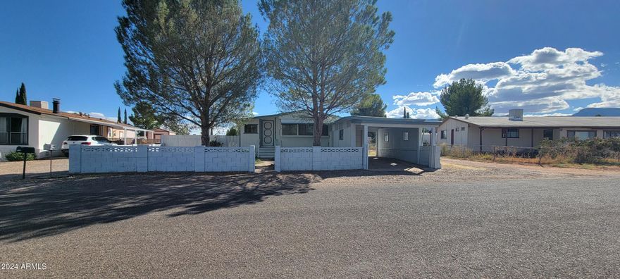 Finally a reasonably priced home that is ready to move in to. This home is very cute. There is a new roof on the West add on/workshop and carport. There is new flooring and paint too. New lighting fixtures and solar tubes make this really light inside. The home is fenced and site an a really large lot with an RV gate. Do not miss this one , IT WILL SELL FAST!! The square footage of the West Add On is NOT included in the square footage, the east add on is.