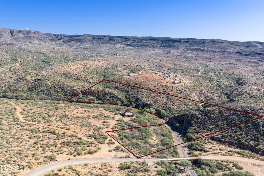 15 acres of pristine high Sonoran Desert land next to the seasonal Turkey Creek. Mountain views in every direction with easy access off the Crown King Road. Convenient location for access to the Prescott National Forest, Crown King and more! At approx 3100 feet in elevation, the weather is considerably cooler than Phx.  Potential for multiple building locations. Power on the property. The adjacent 5 acres is also for sale!