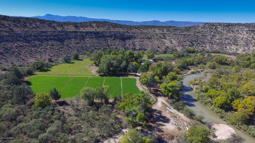 Own a piece of history, once in a lifetime property with 314 acres and endless opportunities.  Hidden between the Coconino National Forest & Montezuma Castle, the Dyck Ranch is the perfect retreat destination with 360-degree views, 22 acres of irrigated farm land with water rights, angus cattle, 1.5-mile year-round Wet Beaver creek, 3 wells, pond, footbridge, extensive wildlife and charm.  Privately owned by artist Paul Dyck for over 65 years with the 2525sqft limestone house built in 1959 and remodeled in 2010 with 18ft ceilings, floor to ceiling windows, mezzanine and more!  The varied topography offers an extensive riparian habitat, gently sloping hillsides, rocky outcrops and pastures.  Numerous building sites available.  Just 100 miles to Phoenix and 21 to Sedona. The Dyck Ranch- A spectacular creek front ranch in central Arizona. This is the quintessential Western ranch and artist retreat- with a year around 1.5 miles of Wet Beaver creek running thru it, very rare in Arizona. It is at 3500ft elevation, with a 2525 sqft limestone home built in 1959 by renowned Western artist Paul Dyck, and completely remodeled in 2010. The home has a large art studio, 18ft ceiling and tall windows. Kitchen, 2 bed/1 bath and a loft for office. The topography is varied with an extensive riparian habitat, gently sloping hillsides, rocky outcrops and pastures. There are 22 acres of irrigated pasture producing alfalfa and grass hay. Water rights and wells. This hidden retreat is immersed between the Coconino NFS and Montezuma Castle National Monument. 314+/- acres, 100 miles from Phoenix and 21 to Sedona.
-Owned by Paul Dyck for over 68 years and still owned by the Paul Dyck Foundation
 
- One of largest privately held properties in the area
 
- Ranch is home to its own Angus cattle
 
- Other property uses such as, equine facility, camp retreat, or winery.