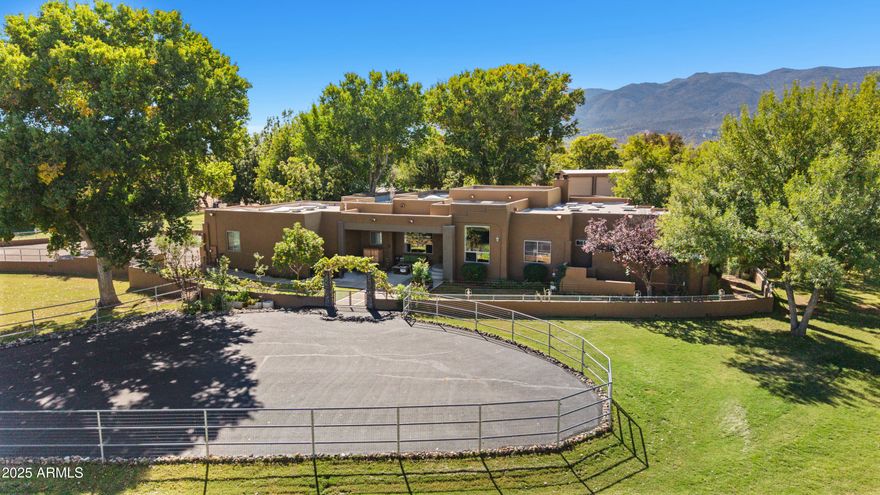 Discover refined country living on this breathtakingly beautiful16.21 acre riverfront property complete with exceptional equestrian amenities and two beautiful homes.         
Main residence has 4 bedrooms and 3 baths with a well appointed kitchen and wet bar, a lovely screened in patio, as well as 3 car garage.
Guest house features 2 bedrooms and one bathroom  including a laundry room.
The equestrian facilities include a 6 stall barn with a bathroom and laundry facilities, hay storage 20 X 66, premier riding arena, irrigated pastures, and complete perimeter fencing.  Raised gardening beds, dozens of fruit and nut trees, and a 25 hen chicken coop.  This property combines   3 parcels.            APN     404-01-052S 8.45 Acres
APN 404-01-052L  3   Acres
404-01-142D 4.76 Acre