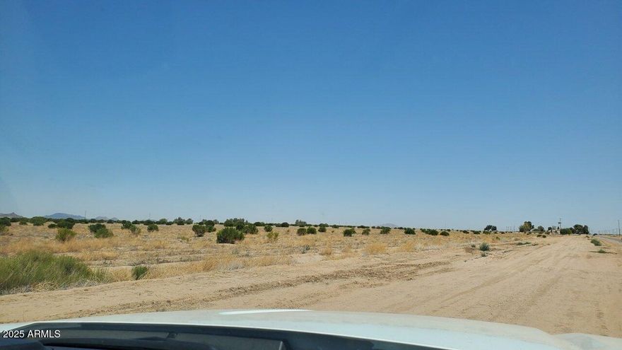 10+ Acres of true seclusion isn't just rare—it's almost impossible to find. Until now. This parcel in Eloy offers absolute privacy with ELECTRIC ACCESS ON PROPERTY! No neighbors. No traffic noise. No streetlights. Just you, the land, & endless horizon in every direction.

Build your dream homestead without compromise. Set up an off-grid sanctuary. Create your own private compound. Or simply own a piece of untouched desert where no one can bother you—ever.

Out here, you make the rules. You decide what happens on your land. Stop imagining what true serenity feels like. Come experience it yourself.

Seller will carry! Parcel ''E-1'' Is the GREEN rectangle on the colored survey. THIS LISTING IS FOR THIS 10.109 ACRES ONLY.  See attached survey in photos to guide you to the lot.