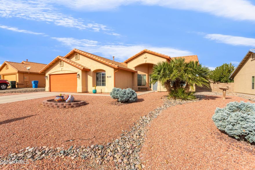 Gorgeous four bedroom two bath home with an open concept, living room, dining and kitchen area that have a grand feel with its vaulted ceilings and large windows. Split floor plan with 1 guest bedroom close to the front entry, 2 guest bedrooms down a separate hallway along with guest bathroom and the master bedroom located off from the kitchen. Master bedroom is very spacious and your on suite bathroom is through the barn door. Large walk in closet with a thoughtful system in place for easy organization. Step outside to be wowed in what could be your own private oasis with a gorgeous landscaped backyard, covered patio, and in ground pebble tech swimming pool. Enjoy the best part of Arizona in this yard. You truly don't want to miss your chance to make this house your home.