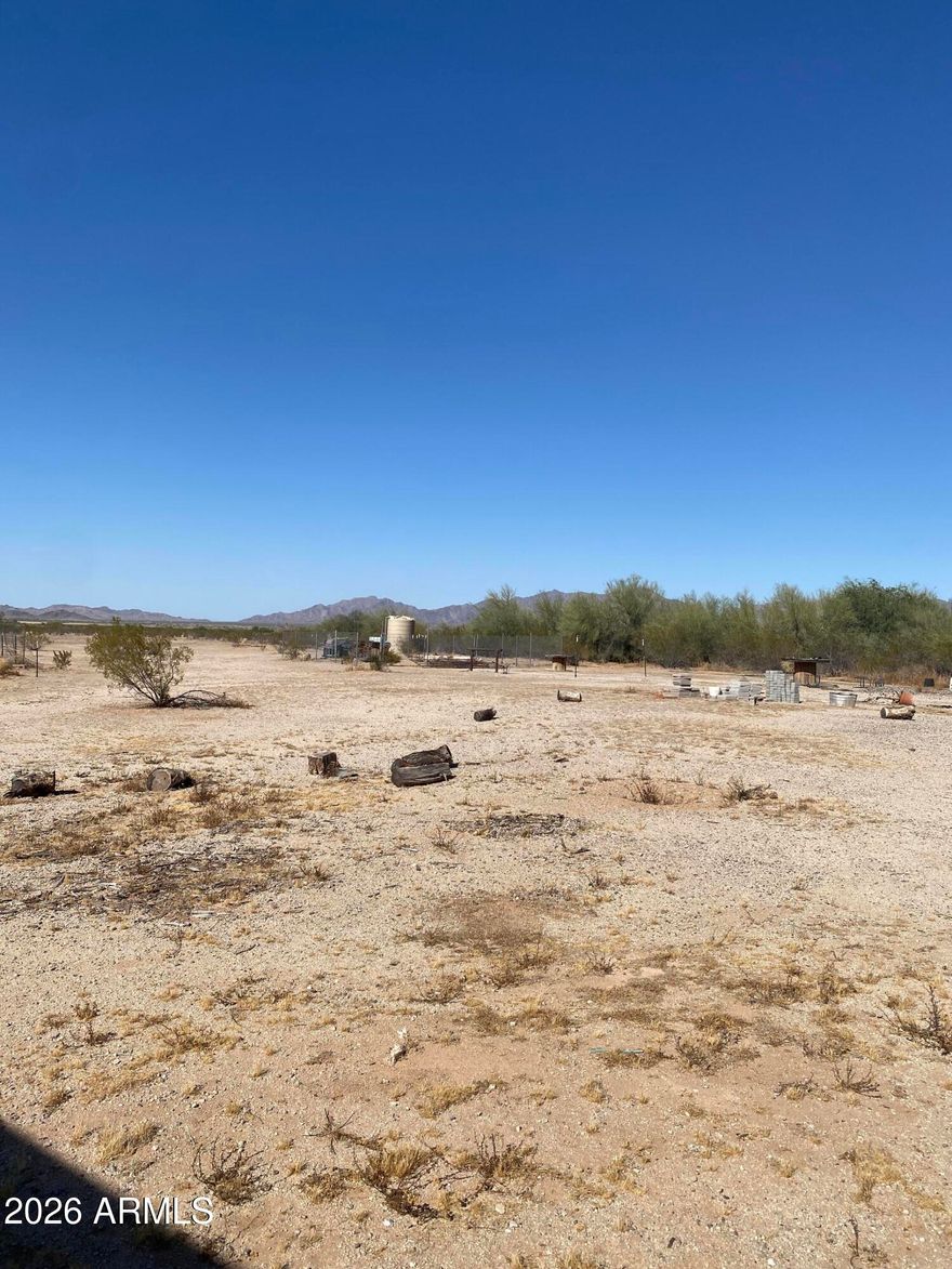 Discover the freedom and possibilities of rural living with this beautiful 10-acre property in the highly desirable Rainbow Valley area. This ready-to-build
parcel already features a private well, electricity on the property, and an existing septic system -- saving you time and money as you bring your vision to life.
Surrounded by breathtaking mountain views and Arizona's peaceful desert landscape, this property offers the perfect setting for a custom home, ranch, farm, or
weekend retreat. With plenty of space for horses, livestock, toys, or future expansion, you can enjoy the privacy and open space that make Rainbow Valley so
special while still being within reach of city conveniences. Don't miss this rare opportunity to own usable acreage with key improvements already in place.