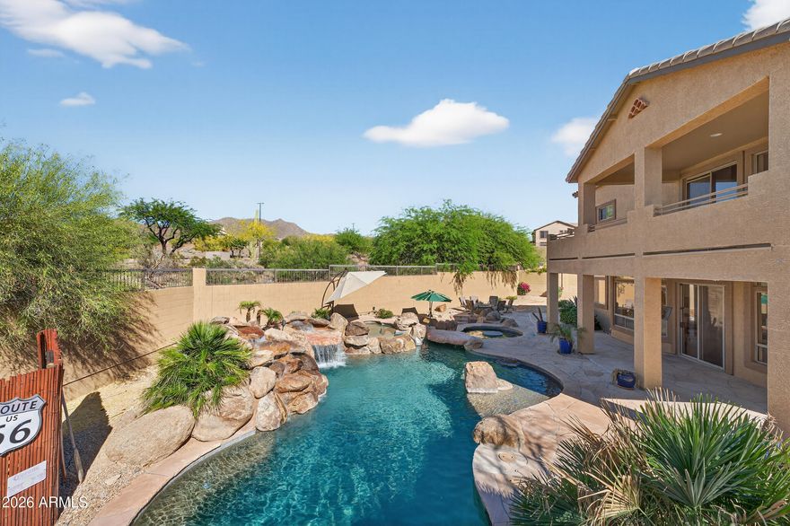 Resort-style living awaits in the prestigious Las Sendas golf community! This exceptional 4 bed, 3 bath 3 car garage home offers the perfect blend of luxury and lifestyle. Whether you love to entertain or simply want to feel like you're on vacation every day, 7538 E Tyndall Cir delivers. Located on a quiet, gated cul-de-sac, the home features soaring ceilings, an expansive kitchen ideal for gathering, and spacious living areas filled with natural light. The luxurious primary suite includes a cozy fireplace, 2 walk in closets, a generous flex space for an office, gym, or retreat, and a private balcony with stunning mountain views. Step outside to your private resort backyard with a corner lot, sparkling pool, waterfalls, waterslide, hot tub, fire pit, and beautifully designed landscaping.