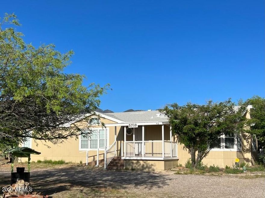 PRICE REDUCTION! Do you enjoy Country Living with Mountain Views?? THIS is the place for you! Located on a corner lot with 1+ acres of land and a fully fenced back yard with plenty of space to park an RV. The large storage building with electrcity can be a garage, workshop or?? This lovely home also has a built-in entertainment center, an Arizona room and a brand new roof in 2018. Call for a private tour today!