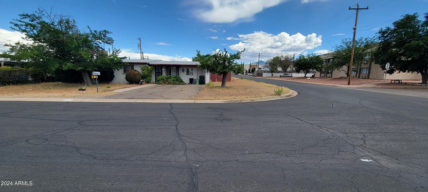Here is a great opportunity to purchase a reasonably priced home! There were 2 add ons done to the original floor plan adding a room in back as well as a garage conversion and room behind that. There is a unique main bath that is handicap accessible. The home sits on a corner lot and has a nice fenced yard as well. This one will not last.