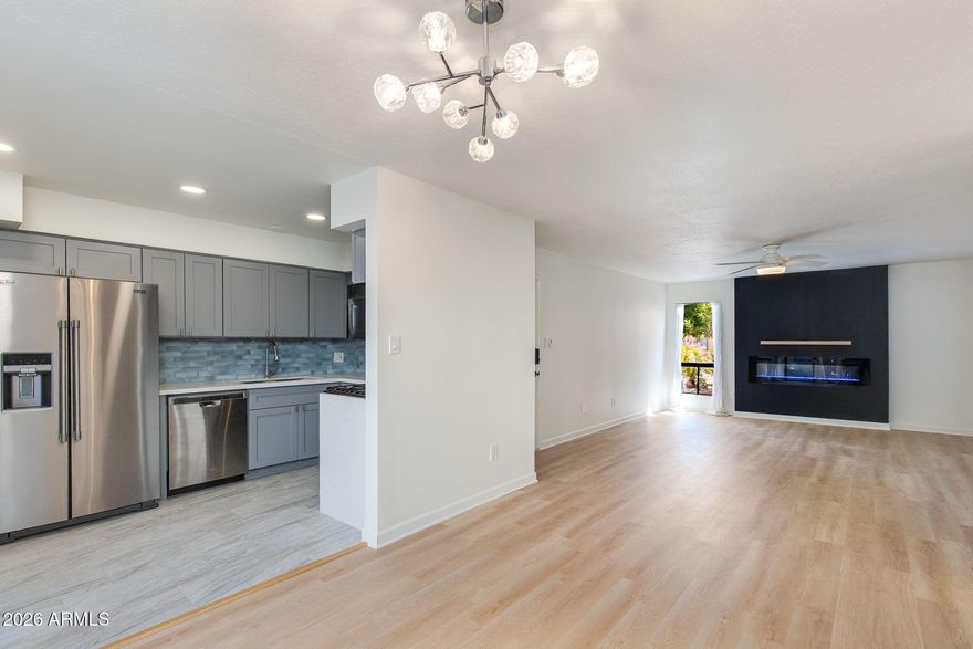 Welcome home to your charming ground-floor condo positioned in one of the best locations in Old Town Scottsdale. Newly renovated with vinyl plank wood flooring, full master bathroom renovation, and more. HOA fee includes ALL utilities (electric with no cap, W/S/T, gas). Whether you're looking for a primary home, lock n' leave, or investment rental, look no further. Featuring SS appliances, gas range, and a shaded patio with storage/in-unit laundry. Walking distance from the best of Old Town shopping, nightlife, and restaurants! Not a spot was missed in this fully turnkey, low maintenance unit positioned just steps from the community pool.