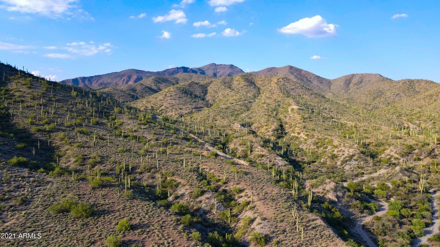 Rare 56-Acre Cave Creek Sanctuary - Level Land Meets Mountainside Views!
Discover a one-of-a-kind 56-acre property in Cave Creek, Arizona, offering both level land and dramatic mountain terrain - at the scenic Mexican Hat, ideal for hiking or building a custom hillside home with panoramic views. This exceptional parcel provides endless possibilities: create a private luxury estate, equestrian ranch, or peaceful family compound surrounded by the beauty of the Sonoran Desert. Enjoy space for horses, guest homes, or outbuildings, along with unforgettable sunsets, city lights, and starlit nights. Perfectly positioned between the charming towns of Carefree and Cave Creek, you're minutes from dining, art, and shopping, and and only 45 minutes to the airport. This property combines privacy, nature, and convenience, making it an unparalleled opportunity for Arizona land buyers seeking both beauty and potential.