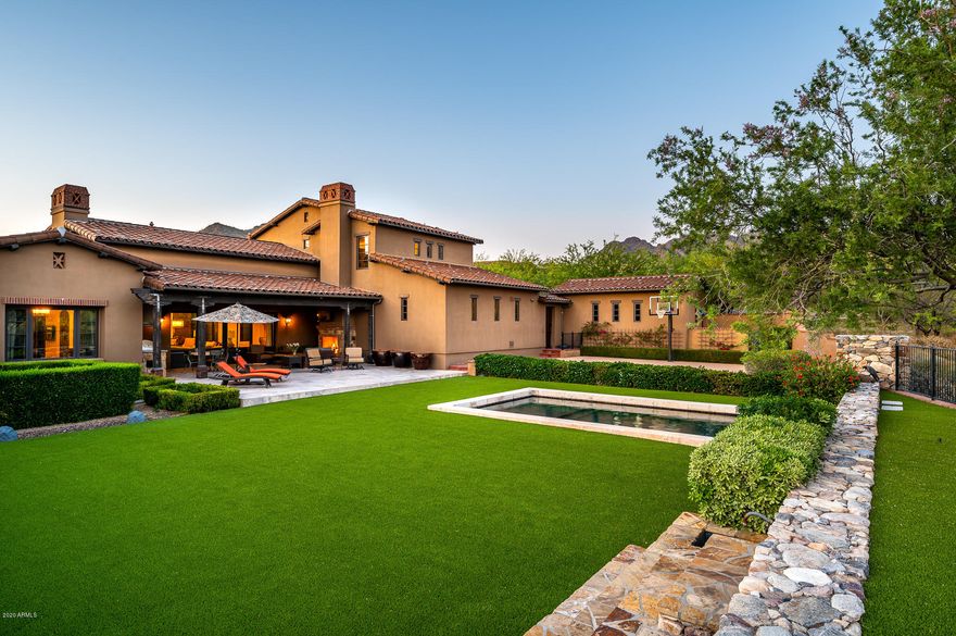 SIMPLY STUNNING home in the prestigious guard gated Village of Silverleaf on a  private south facing lot.  This home offers majestic mountain, desert and city light views and the indoor/outdoor lifestyle that allows you, your family and friends an opportunity to enjoy the best in entertaining. This 5,435 sf home offers the finest in finishes including French Oak hardwood flooring, wood beams, large Kolbe motorized glass pocket doors, media room and a 700 bottle controlled wine cellar. The kitchen offers plenty of distressed Alder cabinets, large kitchen island, Quartzite leather stone countertops with travertine backsplash. The premium appliance package includes Professional Wolf SS appliances with Subzero built in refrigerator and Subzero refrigerator/freezer drawers. The outdoor living spaces features a large covered patio with fireplace and built in BBQ. The large sport court and swimming pool support an active lifestyle while the spa & cozy firepit encourage relaxation to pause & enjoy a breathtaking sunsets.