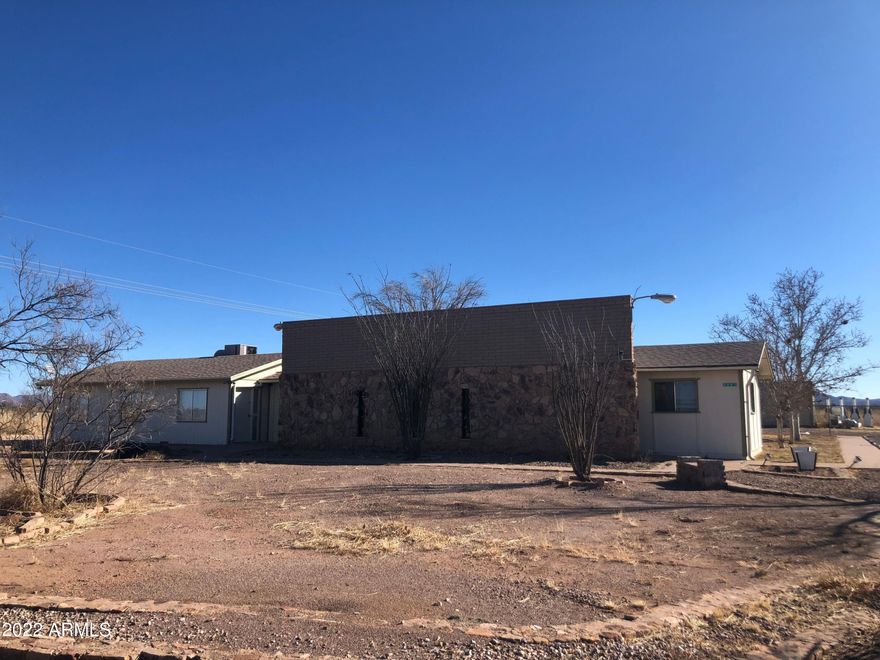 This Property features 3 Different Buildings.  Main Building has a nice reception/waiting area.
Large Meeting Area with Kitchen Facilities, 8 Bedrooms, Separate Bathrooms and Showers, 8 Offices the could also be used as Bedrooms, Building 2 is a 2 Bedroom Apt, it's own kitchen and Bathroom.  Building 3 is a Large Metal Warehouse!!