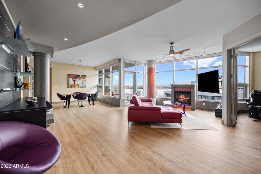 Experience the pinnacle of lakeside luxury at Bridgeview.  This stunning, remodeled home boasts an impressive floorplan, with its emphasis on functionality,  privacy and views.  The two master suites are separated by the living space, with the additional large office providing a light-filled space to work.  Each bedroom has its own bathroom that incorporates a spacious vanity, with a soaking tub and separate glass-paneled shower, and includes a substantial walk-in closet with built-in organization.   Large windows and access to the balconies give each bedroom an expansive feel and views of the mountains and lake beyond.  The half bath provides guests privacy off the living area. Pride of ownership abounds, with attention paid to the finest detail to ensure a seamless transition. The living room, dining area and kitchen provide considerable open and connected spaces for entertaining.  Or relax by the gas fireplace framed by windows showcasing the skyline.  Natural light is abundant from the floor-to-ceiling glass that lines the entire wall, with east-facing, panoramic views of Four Peaks, Tempe Town Lake, and the preserve mountains that border Arizona State University.  

The kitchen has been redesigned with a 2023 remodel that includes gorgeous, one-of-a-kind quartzite counters, new modern cabinets that offer abundant storage, an undercounter beverage refrigerator, GE Cafe appliances, gas cooktop, water filtration system with hot water on demand, and a touch-free faucet.

The 2nd master suite includes a built-in Murphy bed with cabinets and shelving from California Closets, making it perfect for guests and yet providing the ability to transform the large area into a usable space for a fitness break, a craft room, or whatever you can imagine.  The den/office offers abundant space, perfect for working from home.  It easily accommodates two desks with room to spare, and includes built-in wood cabinets and further storage. 

Additional upgrades include new luxury wood-look laminate flooring throughout, combining an understated high-end design with durability and functionality.  Motorized blinds in the bedrooms provide privacy and convenience.  Installed speakers in multiple rooms give the ability to coordinate music and surround sound.  Integrated smart home technology offers convenience and functionality over light, climate and sound controls.  Water detection sensors in all pertinent areas give added assurance and peace of mind.  

As original owners in the building, the unit is able to offer a rare opportunity for 3 deeded parking spaces (2 w/ EV charging), and a dual sized storage unit that is air conditioned.  All is underground and gated, with privacy and security paramount. 

Bridgeview is professionally managed to the highest standards, with strong reserves and caring staff, offering amenities that aren't available in other high-rise communities.  Enjoy peace of mind with a 24/7 front desk attendant with concierge services and night patrol security. Relax in the heated lap pool and spa or lounge by the pool and take in the water views that overlook the lake. The additional outdoor areas include a fireplace seating area, barbeque grills, green space with a game area, and a wood-fired pizza oven.  A fitness center is filled with high-end equipment, locker rooms, and a sauna and steam room.  Play billiards, watch a movie in the theater room, reserve the club room with a kitchen for parties and events, or relax in the library with a good book near the fireplace. 

The HOA monthly dues also include utilities: with electricity, gas, water, garbage collection, water softener with hot water heating, and other city services covered in one payment.  

Location is a key feature of Bridgeview, with Tempe Town Lake as your front yard, Arizona State University as your back yard, and the restaurants, shopping and entertainment of Mill Avenue and downtown Tempe as your playground.  Step out of your building and within minutes you can walk the trails along the lakeside or paddleboard off the dock.  Have a picnic at Tempe Beach Park or enjoy an outdoor concert or event.  Cheer on Sun Devils football or watch a Broadway show at Gammage Auditorium.  Pick up the light rail to have access to the east valley or Downtown Phoenix, or drive 10 minutes to Sky Harbor Airport to explore even farther.  

Bridgeview combines all the comforts of luxury living without leaving your doorstep, with an ideal location that provides access to the entire Valley and beyond within minutes.  Furnishings are available as well.  Welcome home to truly effortless style and livability.