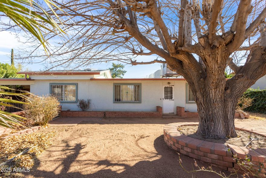Sweet gem of a house on the west side!  Includes a large kitchen with gorgeous wood cabinets and a huge breakfast bar, separate dining area and room for your office.  Wouldn't take much to make the entire back of the house a master suite.  Extra large shed in backyard for that workshop you've always wanted!