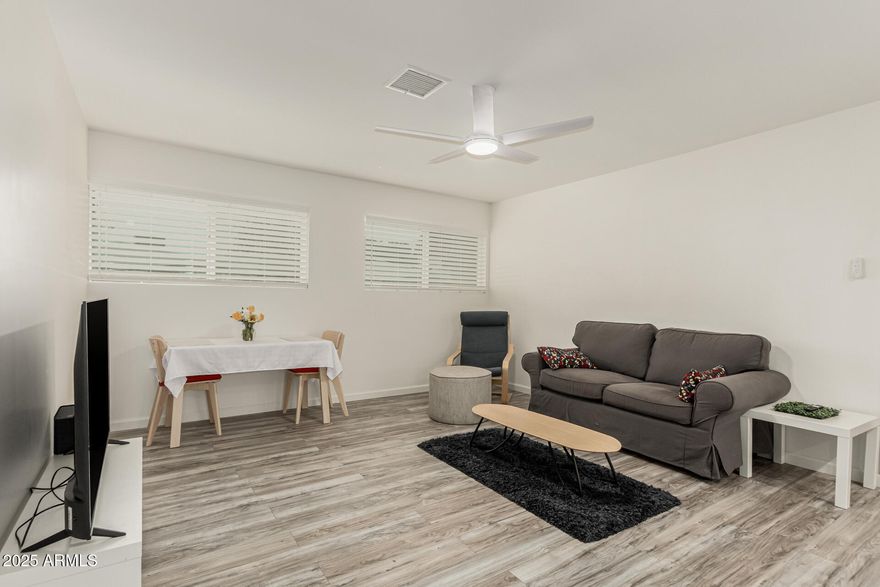 Fully renovated 1 bed / 1 bath Scottsdale East housing cooperative offering an affordable path to a coveted Scottsdale address. Owner-occupied only; no rentals permitted. This 684 SF unit was completely remodeled with an opened kitchen featuring new cabinetry, tile countertops, added storage, can lighting, and newer appliances including electric stove/oven, dishwasher, refrigerator, and built-in microwave. New luxury vinyl plank flooring in great room and bedroom, tile flooring in kitchen and bath, popcorn ceilings removed, all new windows, new drywall over slump-block walls, new rooftop HVAC, and gas water heater in its own entry closet. Enlarged bedroom with new slider to covered balcony overlooking pool. Cash only. Buyer purchases 1 fractional interest; no deed conveyed.