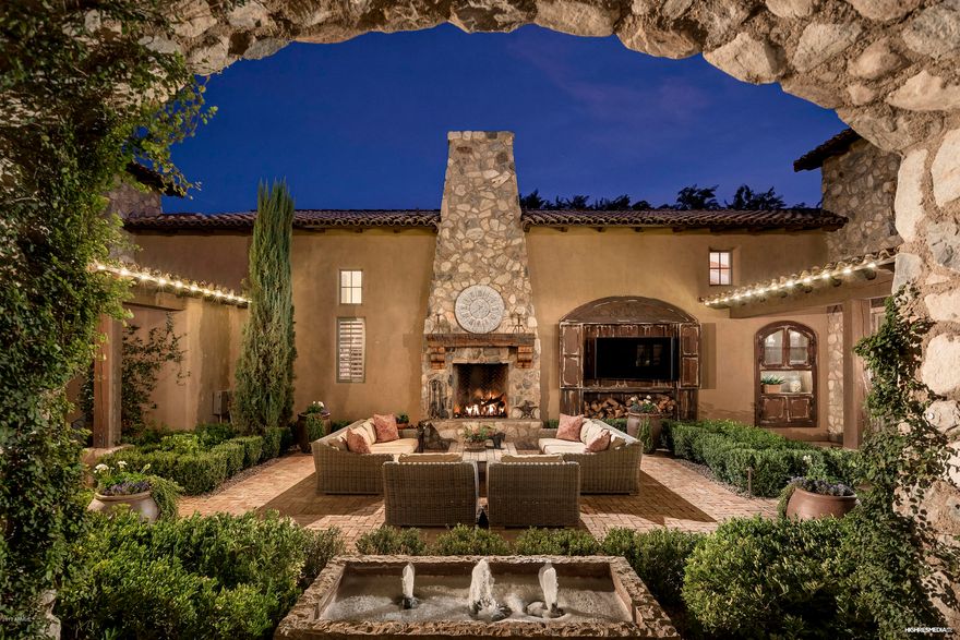 Timeless Rural Mediterranean estate home in Arcadia at Silverleaf. Built by Argue Custom Homes in 2012, this property ties together the best of classic styling with current features. Located on an oversized corner lot, outdoor living opportunities abound with 4 distinct spaces to entertain (including 2 covered patio areas and a private spa patio). Home wraps around a center courtyard garden with direct access to private guest house. Desirable greatroom floorplan with open kitchen, main-level master bdrm and office, guest house, 4 car garage, and private guest wing. Venetian plaster walls, extensive beam work, pocketing doors, wood plank & stone floors, 6 fireplaces, outdoor shower and Crestron home automation highlight some of the unique features that make this a true custom masterpiece.