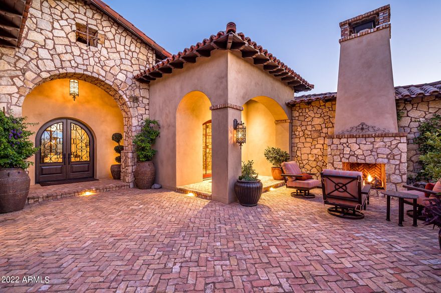 Located in the guard-gated community of Whisper Rock Estates this home has recently undergone a sizable remodel including the kitchen, master bedroom, great room, media room, laundry room and so much more.  Custom built home sits on a south-facing, private 1.3 acre lot.  Enter through a gated courtyard with a fireplace. The updated kitchen has new dual sinks, wine refrigerator and a large central island.  The expansive master suite is split from the additional guest rooms. Bonus/media room.  Backyard features a covered patio with fireplace, heated pool and spa, outdoor kitchen, turf areas and sport/basketball court.  Control 4 system, whole house water softener system, climate controlled wine wall, theatre room, outdoor pizza oven, pickleball court and saltwater pool and spa.