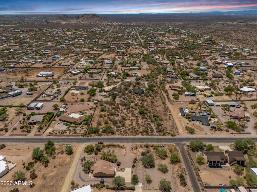 2 ACRES + OWNER FINANCING! / ¡2 ACRES + FINANCIAMIENTO DEL VENDEDOR! Rare opportunity with paved road frontage and breathtaking Superstition Mountain views. Two adjacent 1-acre residential parcels being sold together with MLD Boundary Survey available. Water nearby through AZ Water Co (neighboring properties serviced) and power close by via SRP.

Zoned CR-1A for site-built or tiny homes. NO HOA! Excellent horse property with room for RVs, trucks, trailers, animals, workshops, RV garages, casitas, pools, and more. Create a private desert compound, custom home setup, or investment property while enjoying peaceful desert living with convenient access to nearby roads and city amenities.

NO BANK QUALIFYING / ¡SIN CALIFICACIÓN BANCARIA!