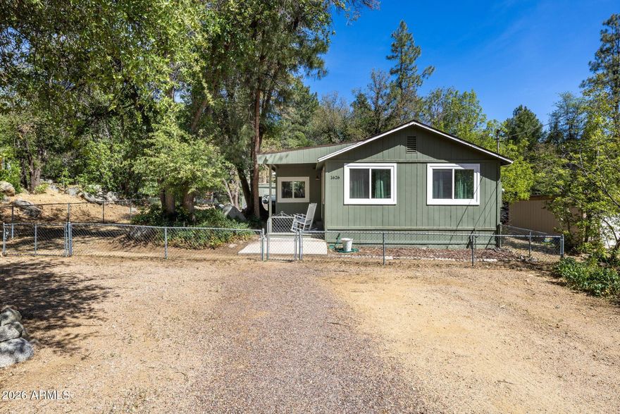 Tucked among the pines in Prescott, this charming home combines comfort, style, and functionality. Thoughtfully updated throughout, the home features an open and inviting layout with white shaker cabinets, stainless steel appliances, updated flooring, and abundant natural light. The spacious lot offers endless possibilities with room to garden, entertain, or simply relax under the covered patio. A flexible bonus area provides the perfect work-from-home setup or creative space. Whether you're looking for a full-time residence, weekend retreat, or investment opportunity, this move-in-ready home delivers Prescott living at its best.
