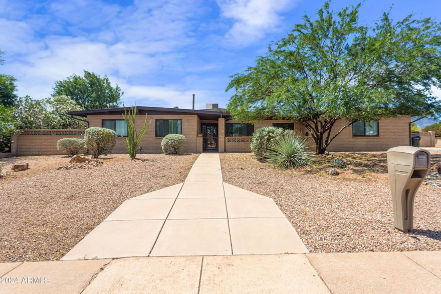 Don't miss out on this spacious 5 bedroom, 2.5 bathroom home in a charming, well established neighborhood. This home features a welcoming courtyard, multiple living spaces, updated kitchen and updated tile flooring through out the house! Generously sized bedrooms, with the primary suite offering a private bath and 2 walk in closets. 

Outside, enjoy the in ground pool and spa, ideal for summer gatherings and relaxation!