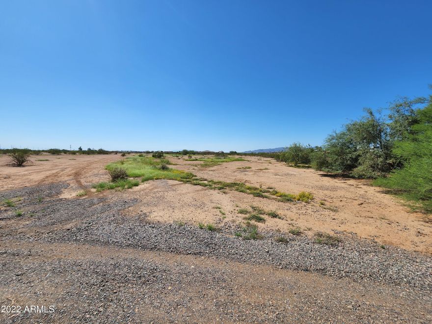 4.6 Acre Parcel, zoned R-43, Flat Useable. Located between Surprise and Wickenburg. Easy Access to Hwy 60, and all the roping arenas. Great Horse property with interest in shared well and electricity. Surrounded by Site Built Homes and Horse Properties.  90' Wall along west side of property. Ready for your Dream Ranch or Custom Home.